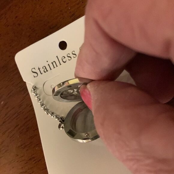 Stainless steel essential oils bracelet/locket with eight pads for your oils. - Picture 2 of 6